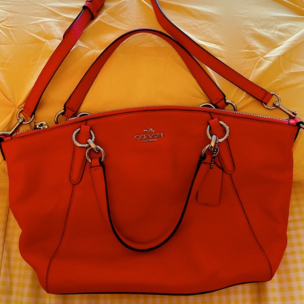 Coach bag with crossbody strap Orange for fall. Hardly used like new flawless